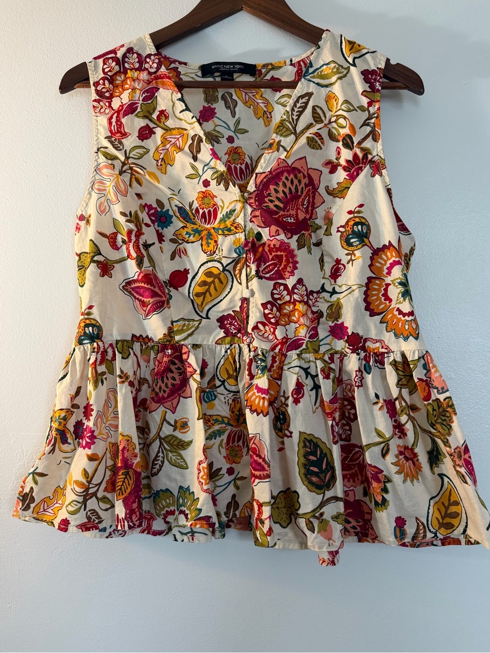 Sleeveless Floral Peplum Blouse in Cream with Multicolor Print